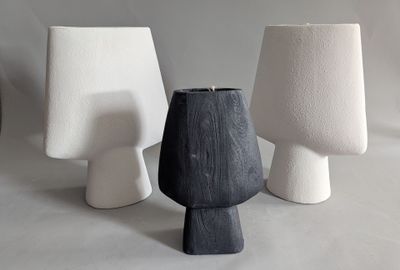 three vases that are sitting next to each other on a table