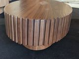 a coffee table made out of wooden strips on the floor