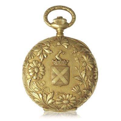 an image of a gold pocket watch with a coat of arms on it