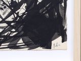 a picture of a black and white painting on the wall