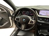 the interior of a bmw car with a steering wheel and dashboard