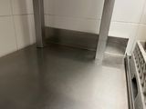 a stainless steel floor in a commercial kitchen