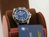 a watch sitting in a case with a credit card in it