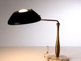 a black lamp that is sitting on a table