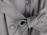 a close up of a coat with a tie on it