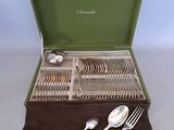 silverware in a green case with spoons, forks, and spoons