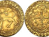 a gold coin with an image of a lion on it