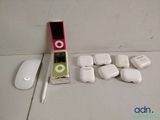 a ipod, a mouse, and some other electronics on a table