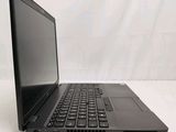 a black laptop with a black keyboard on a white surface