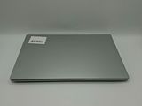 an open laptop computer sitting on top of a white table