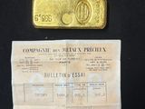 a picture of a piece of paper with a gold bar on it