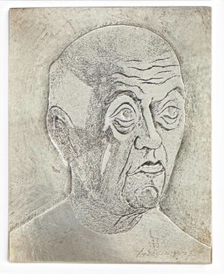dessin représentant le visage d'un homme dans un cadre blanc