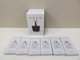 six boxed boxes of coffee sit on a table next to a cup of coffee