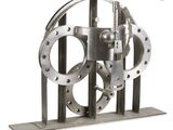 an image of a metal sculpture of a gear wheel