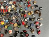 a lot of different types of buttons on the table