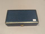 an empty blue box sitting on top of a white table