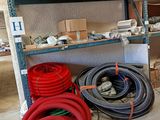 many different types of hoses on the shelves