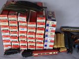a lot of toy trains and train tracks on the table