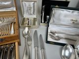 a table with silverware and silverware on it
