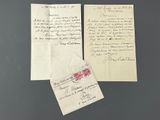 two old letters and envelopes on a table with a black background
