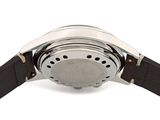 the back of a watch on a white surface with a white background