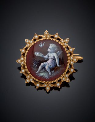 an image of a broochle with a cher and a bird