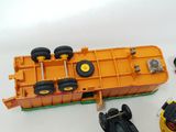 a toy truck and a toy car next to each other