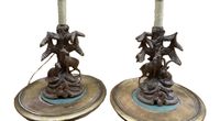 Deux lampes en bois sculpté représentant un couple de chamoi…