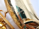 a close up of a saxophone that is shiny and gold