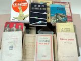 many books that are stacked on top of each other