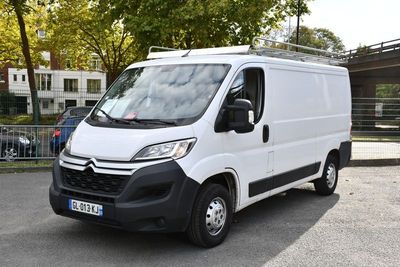 a white van that is parked in a parking lot