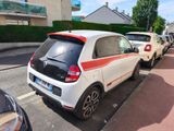 many cars parked on the side of the street