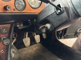 a close up of a steering wheel and dashboard of a car