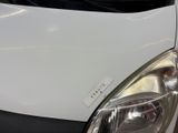 a close up of a white car with a sticker on it