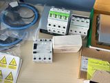 boxes of electrical equipment are sitting on a table in a room
