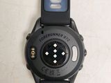 a close up of a watch on a white surface