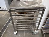 an image of a stainless steel table with wheels on it