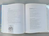 an open book with a picture of a cat on it