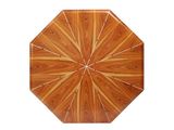 a wooden table with a circular design on top of it