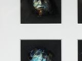 four black and white photographs of a dog with a blue face
