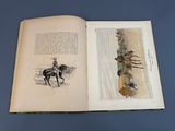 an open book with a drawing of a man on a horse