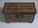 a small wooden box with a decorative design on it