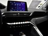 the interior of a car with a touch screen and steering wheel