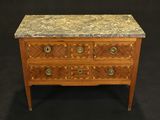 an image of a marble top chest of drawers on a black background