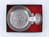 an image of a silver plate with a horse and rider on it in a red box