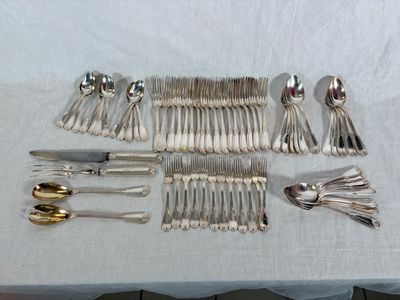 a lot of silver spoons and forks on a table
