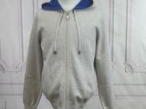 grey and blue zipped hoodie on a mannequin stand