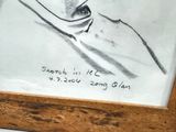 drawing of a man in a suit and tie in a wooden frame