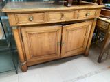 a wooden cabinet with a glass top in a room