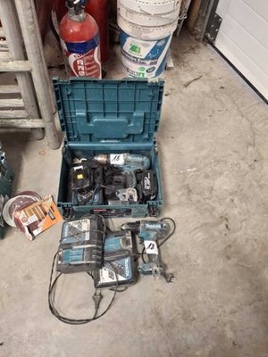 a blue tool box with tools in it on the floor